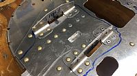 Riveted on the Attach Brackets and the Nutplates