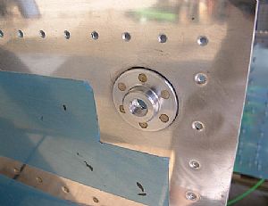 Riveted on the VA-112 drain flange