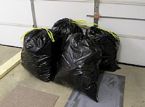 4 trash bags of paper stuffing