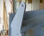 Riveted on the Aileron Brackets