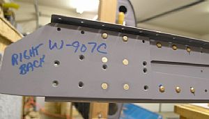 Riveted the W-907B reinforcement fork and W-907C doubler plate